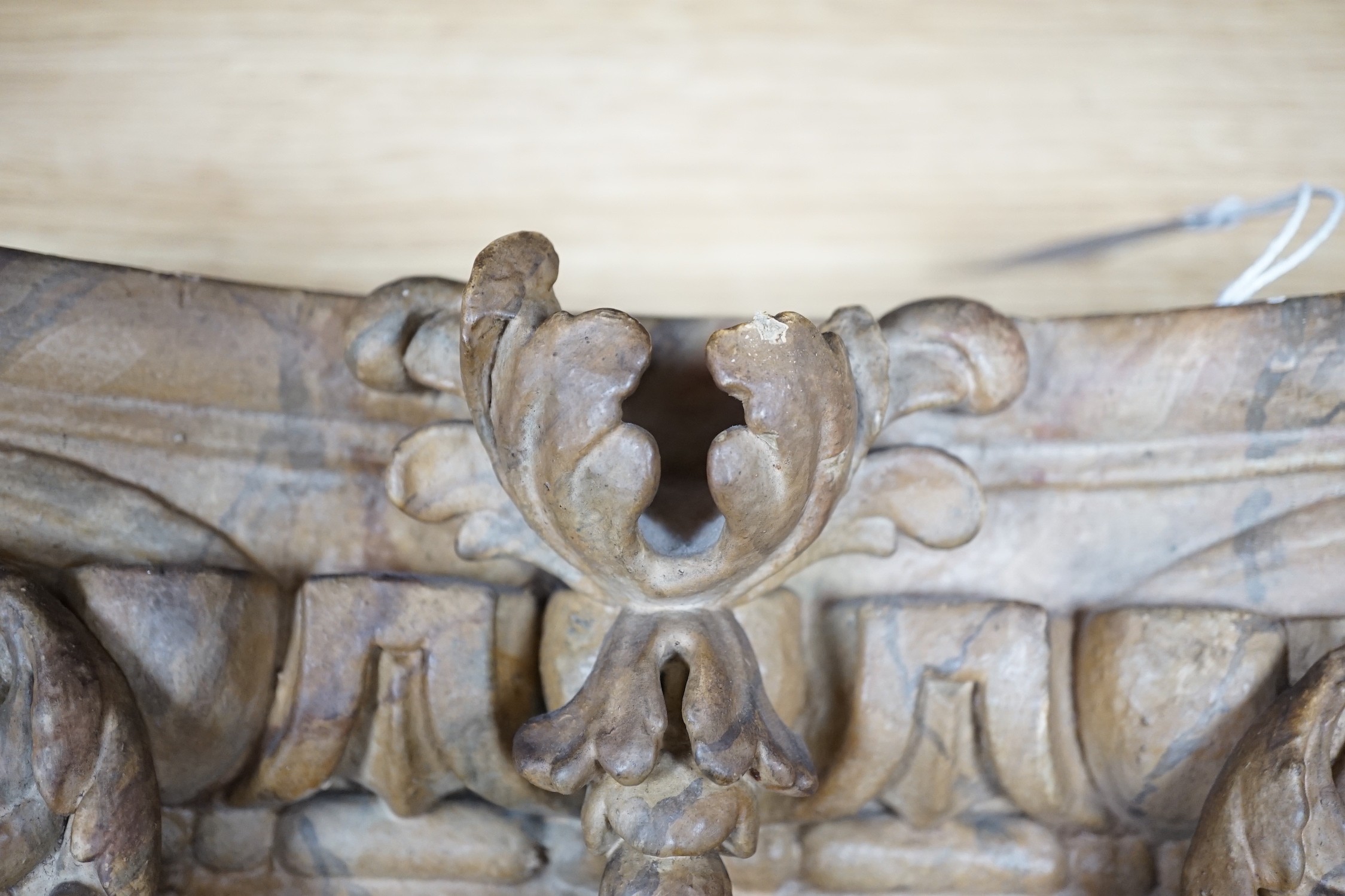 A large 19th century carved pine and gilt-gesso Corinthian capital, 33cms high x 41cm wide (at the top)